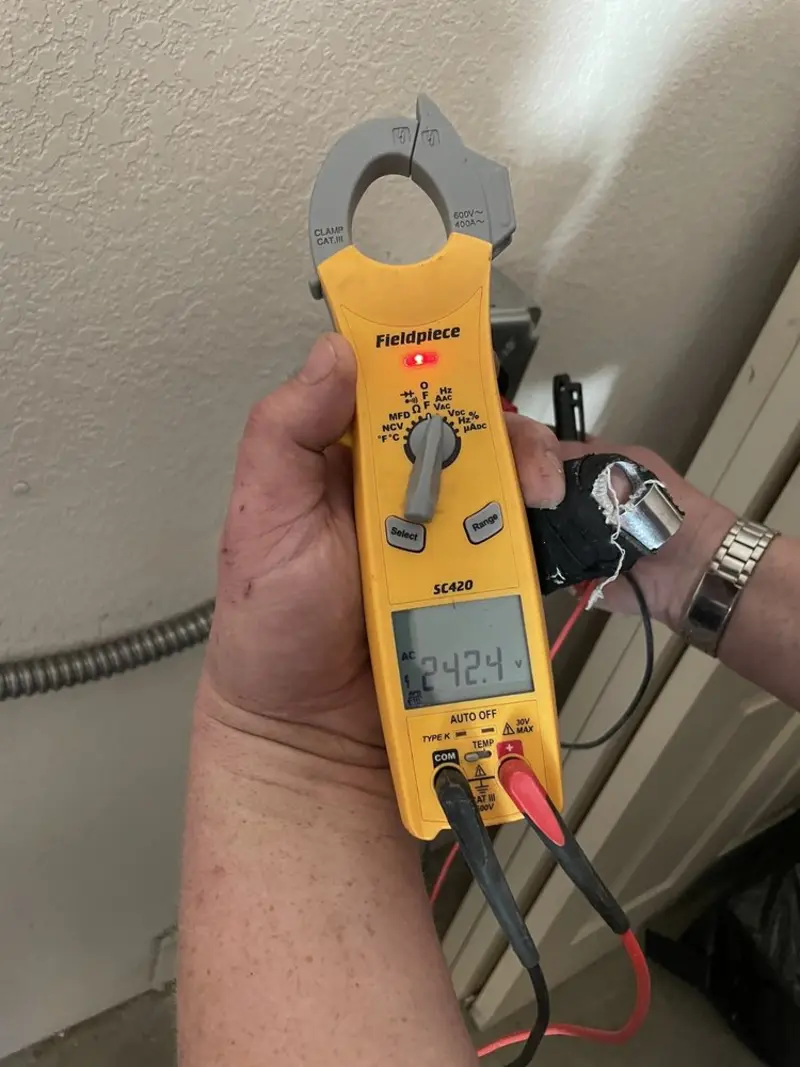 Voltage testing with clamp meter during Generator Installation in North Bay Village